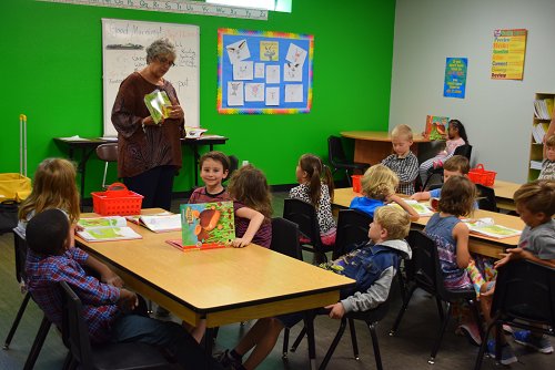 Grou photo of volunteers in classroom